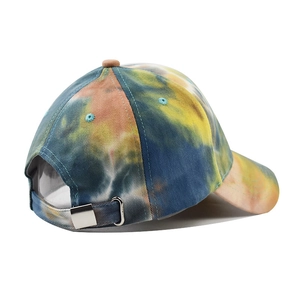 Detail of tie-dye baseball cap featuring a metal buckle and vibrant multicolor canvas