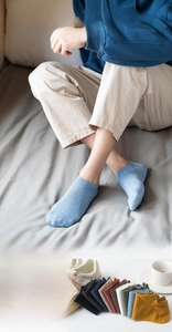Close-up detail of breathable cotton no-show socks in various colors for men and women