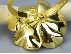 Macro shot of S925 sterling silver hallmark on the back of golden floral ring