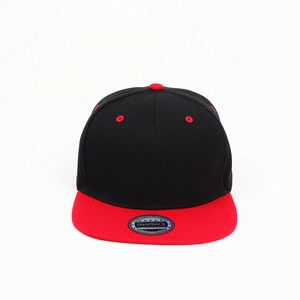 Detail of a black and red flat brim snapback hat with silver holographic quality sticker