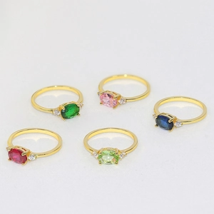 Five-piece gold-plated ring set with oval colorful gemstones and side zircon accents