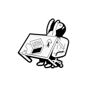 Black and white enamel pin showing a character stretching at a desk with a computer