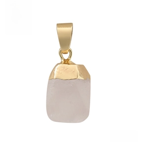 Close-up of a faceted white crystal pendant with a polished gold-plated metal clasp