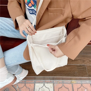 Detailed interior of a beige washed cotton linen tote bag with multi-layer pockets