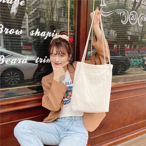 Minimalist cream-white washed cotton linen tote bag with wide shoulder straps for daily use