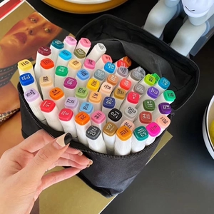 Dual-tip alcohol markers set in a black zippered bag with numbered color caps