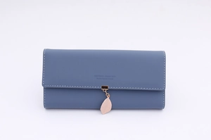 Detailed view of Morandi blue long wallet with white stitching and leaf pendant