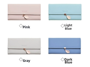 Close-up of long faux leather wallets with leaf pendants in pink, blue and grey colors