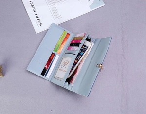 Detail view showing multi-slot interior of light blue long leather wallet with phone pocket