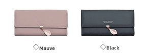 Detail view of long PU leather wallets with leaf zipper charms in black and dusty pink