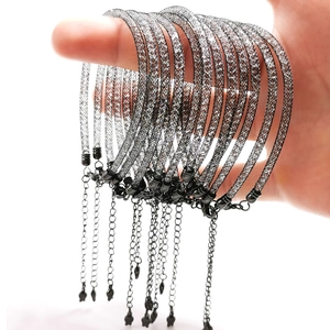 Stack of black mesh stardust bracelets with crystal filling and star charm detail