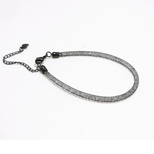 Detail of black mesh choker necklace featuring internal crystals and lobster clasp