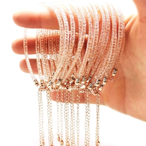 Detailed shot of rose gold mesh bracelets filled with crystals and adjustable chain