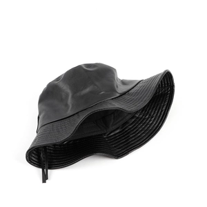 Detail of black faux leather bucket hat showing matte texture and adjustable drawstrings
