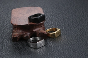 Three-piece set of men's square signet rings in black, gold, and silver stainless steel