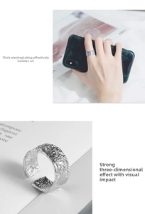 Detail view of S925 silver ring featuring an irregular textured surface and open design