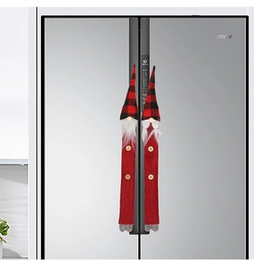Close-up of Christmas gnome refrigerator handle covers on double doors
