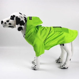 Detail of neon green pet raincoat showing honeycomb waterproof texture and reflective strip