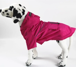 Close-up of magenta pet raincoat featuring honeycomb texture and gray reflective safety strips