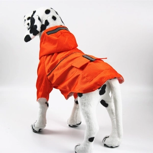 Detail view of the waterproof orange pet raincoat with safety reflective strip and hood