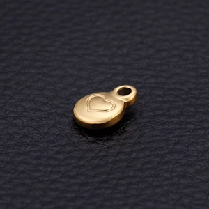 Polished gold heart shaped stainless steel pendant with heart engraving on black leather