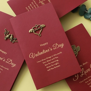Vintage red Valentine card with bronze heart metal charm and gold foil text