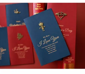 Detail of vintage navy blue and burgundy cards with gold foil poetry and metal charms
