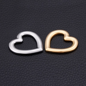 Polished stainless steel heart-shaped charm set in silver and gold finishes