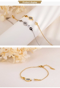 Macro detail of geometric zircon bracelets with water drop pendants and Q charm charms