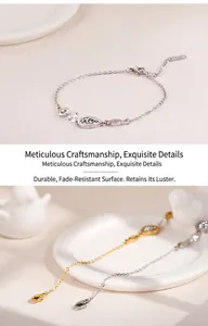 Macro detail of geometric zircon pendant bracelet in silver and gold finish with lobster clasp