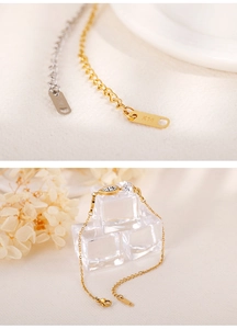 Detail of K14 gold and silver geometric bracelets with sparkling zircons on ice cubes