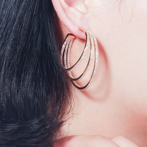 Three-layer rose gold irregular C-shaped hoop earrings with zircon stones on model