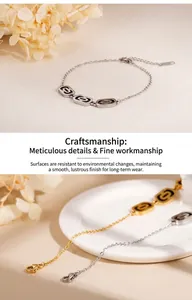 Detailed close-up of minimalist gold and silver bracelets with black enamel oval links