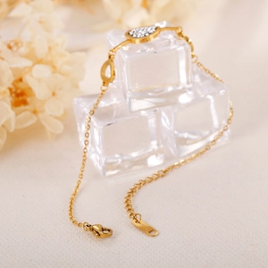 Gold-plated stainless steel teardrop pendant bracelet with micro-pave white zircons