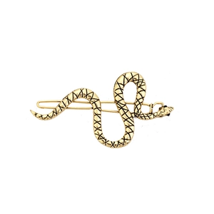 Unique gold snake shaped metal hair clip with textured details and black eyes
