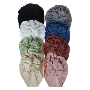 Soft and breathable cotton baby turban hats with ruffled flower detail in multiple colors