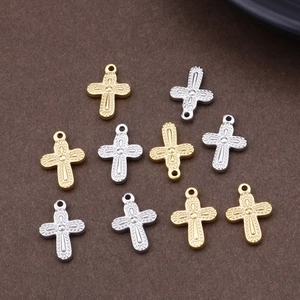 Set of 10 gold and silver metal cross pendants with textured details for DIY jewelry