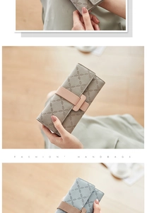 Detail of embossed petal pattern and bicolor ribbon on this long PU leather wallet