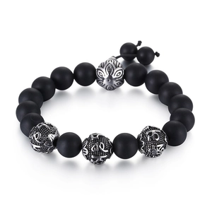 Men's matte black stone bracelet with silver engraved mantra beads and lotus charm