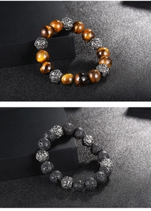 Detailed view of 12mm tiger eye and volcanic lava stone beads with silver charms