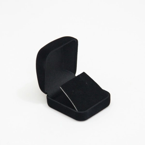 Open black velvet jewelry box with an angled display insert for rings and earrings