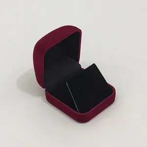 Detailed view of dark red velvet jewelry box with black inner display insert for earrings