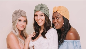 Models showcasing pleated donut turban hats in olive green, khaki, and mustard yellow