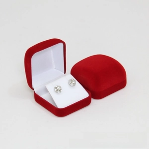 Detail of red velvet jewelry gift box with flap cover and soft white earring holder insert