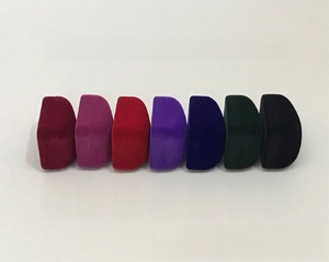 Semi-cylindrical velvet jewelry boxes displayed in seven colors for rings and earrings