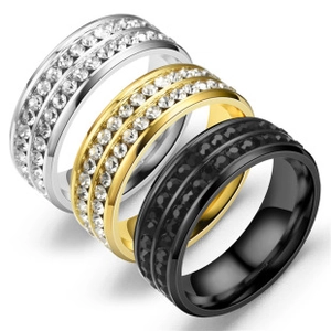 Macro shot of titanium steel rings with double row pave settings in gold silver and black