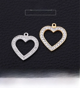 Detailed view of gold and silver hollow heart pendants set with sparkling zircons