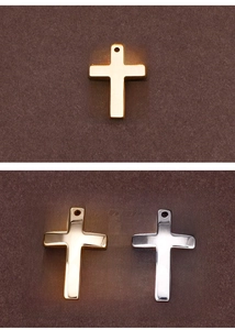 Detailed view of polished gold and silver cross pendants for DIY jewelry making