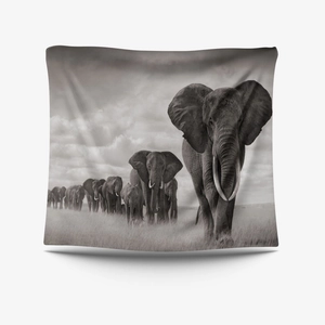 Detail of bohemian fabric tapestry with black and white elephant herd nature photography