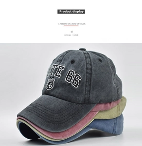 Detail of vintage washed cotton baseball caps with Route 66 embroidery in four colors
